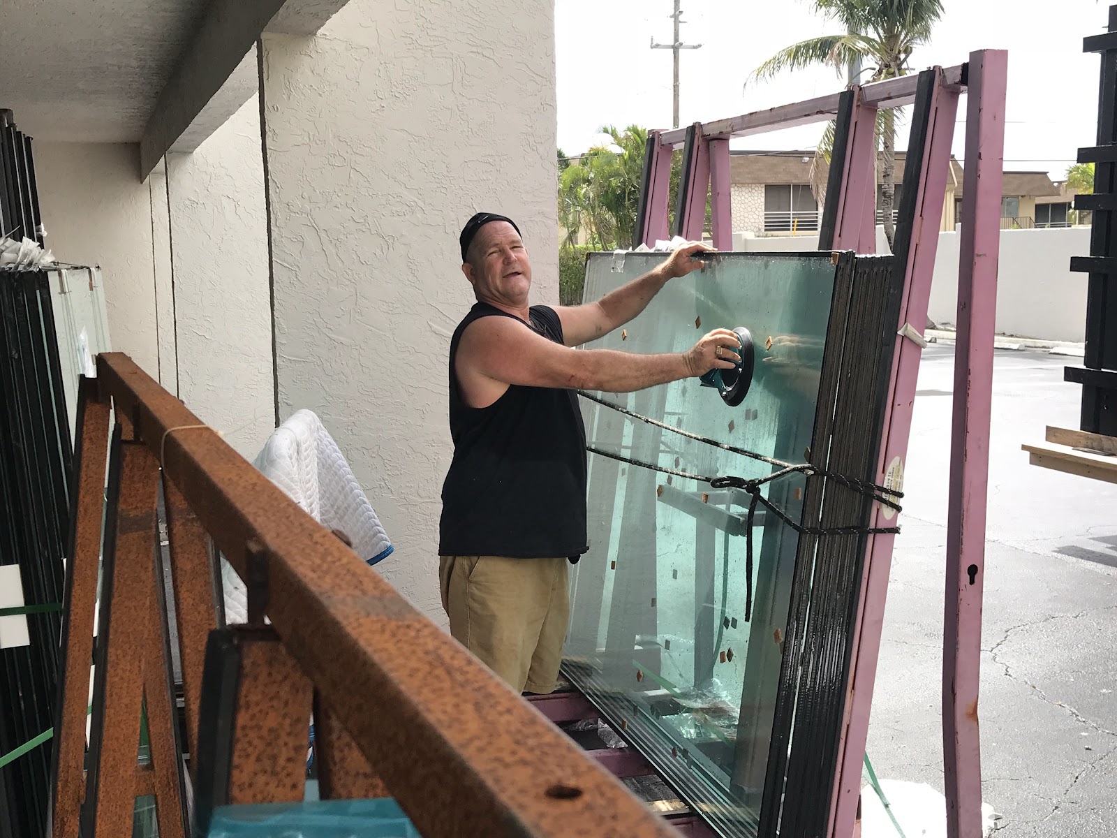 Completed sliding door glass installation overlooking a pool patio